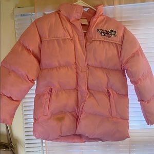 light pink "hello kitty” puffer with fur hood